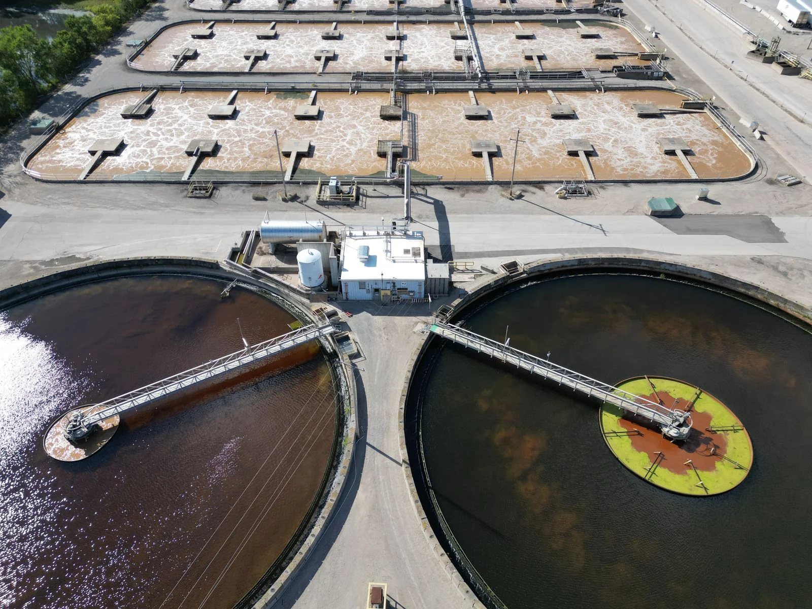 Aerial view of circular tanks and equipment at a water treatment facility